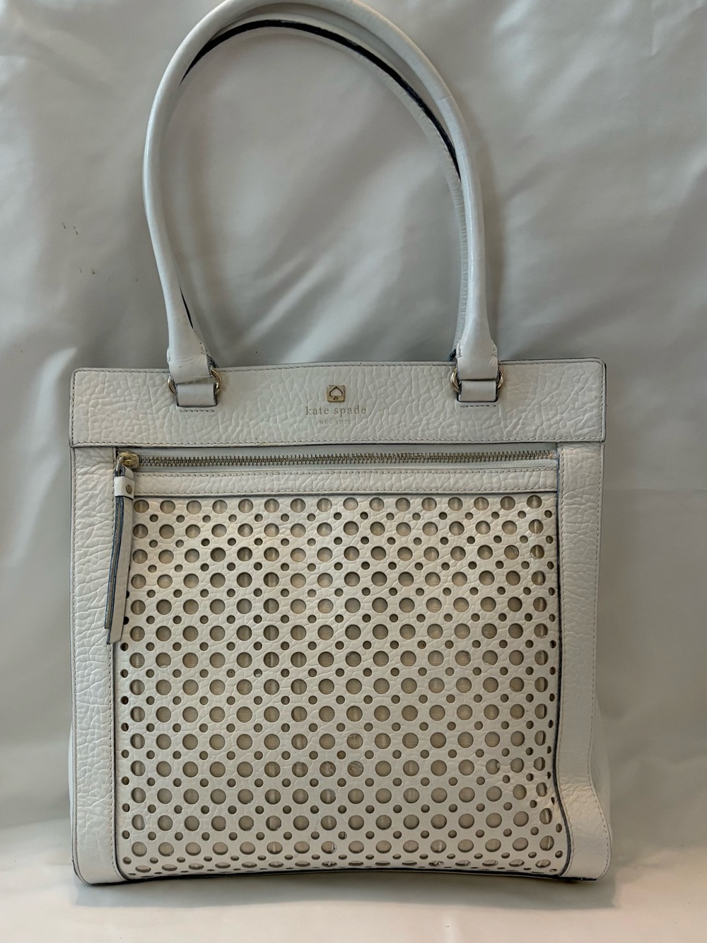 Kate Spade Perri Lane Tote crafted from cream pebbled leather